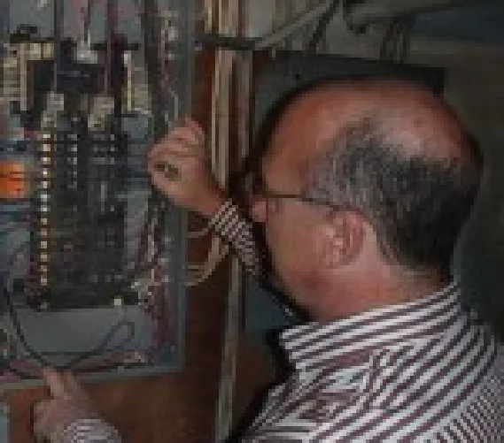 Home Inspector Evaluates Electric Panel